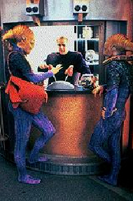Unnamed aliens buying treats on the promonad of DS9 - Uncredited